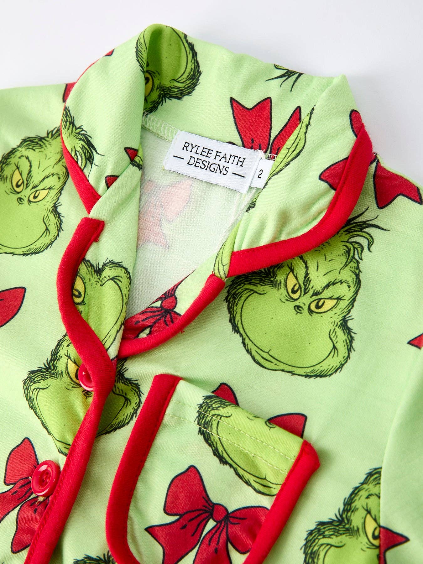 Rylee Faith Designs - Green Christmas Character Bow Print Girls Pajama Set