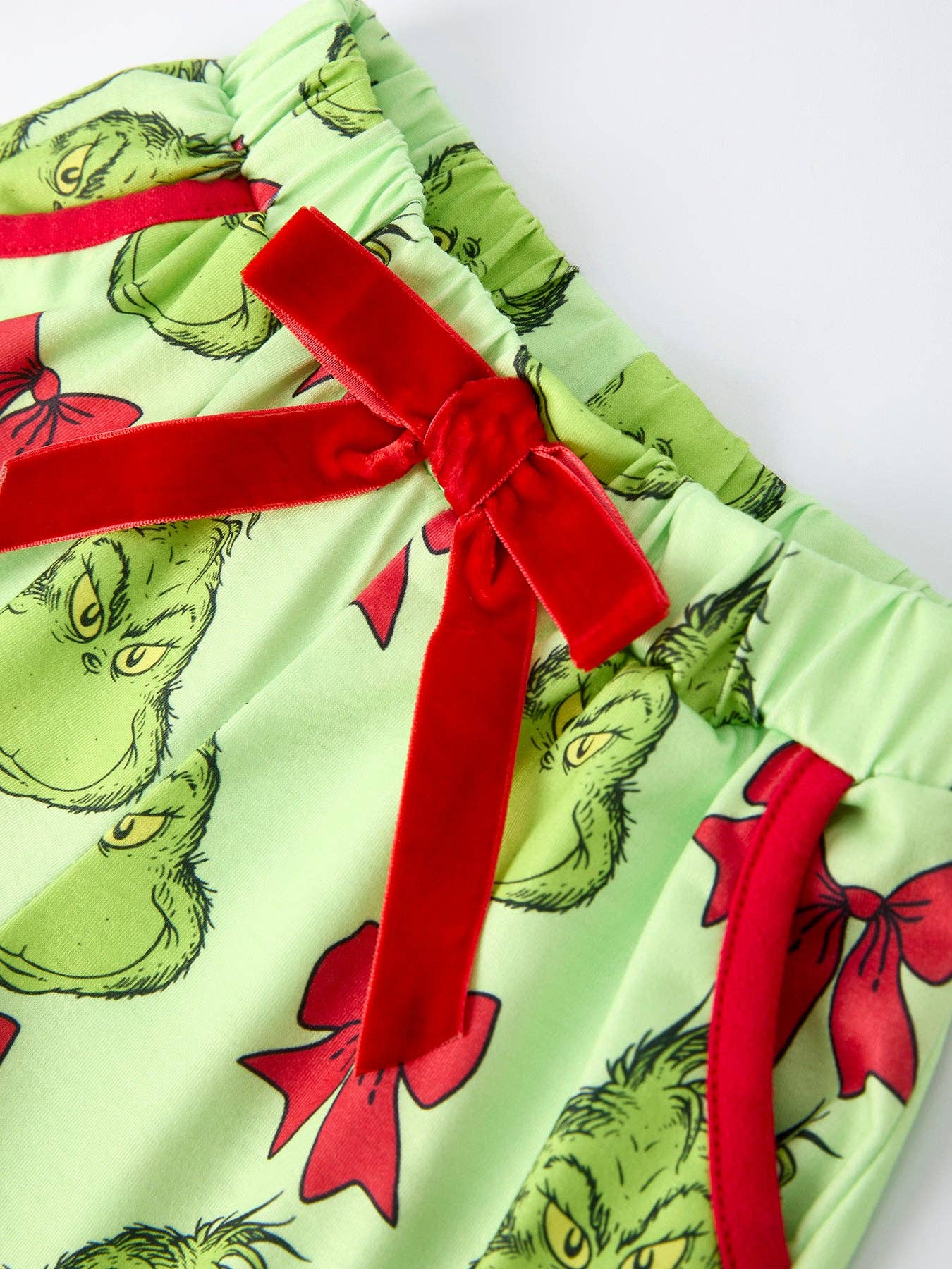 Rylee Faith Designs - Green Christmas Character Bow Print Girls Pajama Set