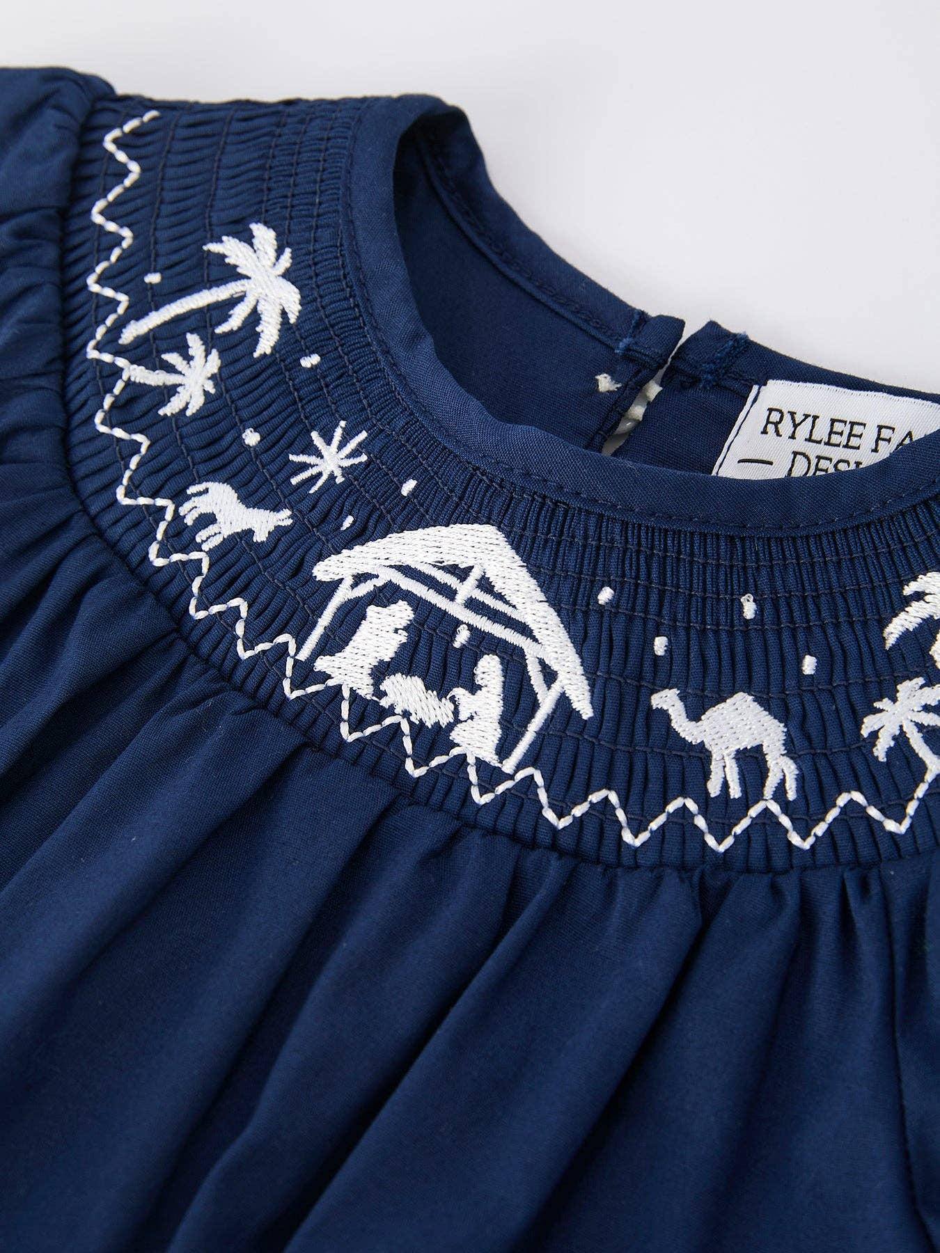 Rylee Faith Designs - Navy Blue Nativity Smocking Embroidered Baby Girls Christmas Romper