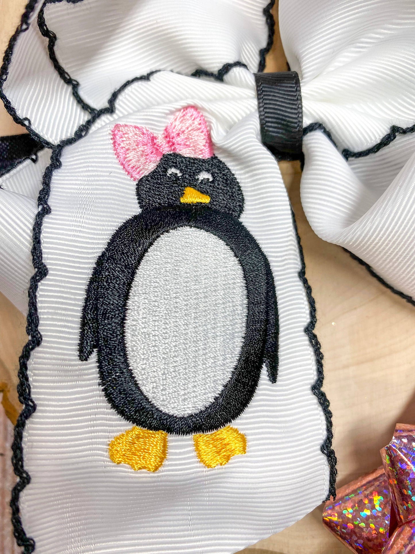 The Hair Bow Company - Penguin Embroidered with Black Moonstitch Hair Bow Headband