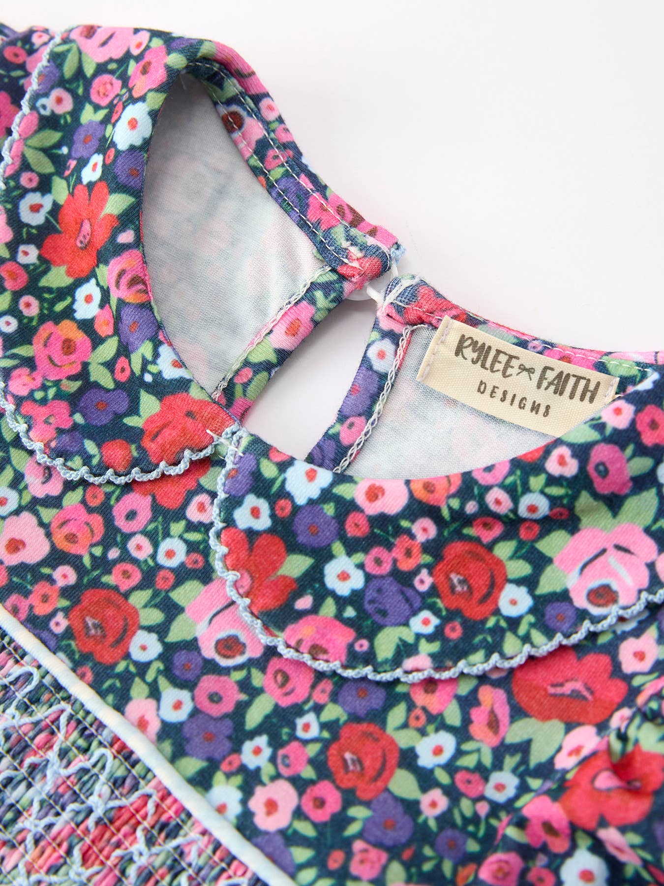Rylee Faith Designs - Blue Bow Floral Smocked Girl Bloomer Set