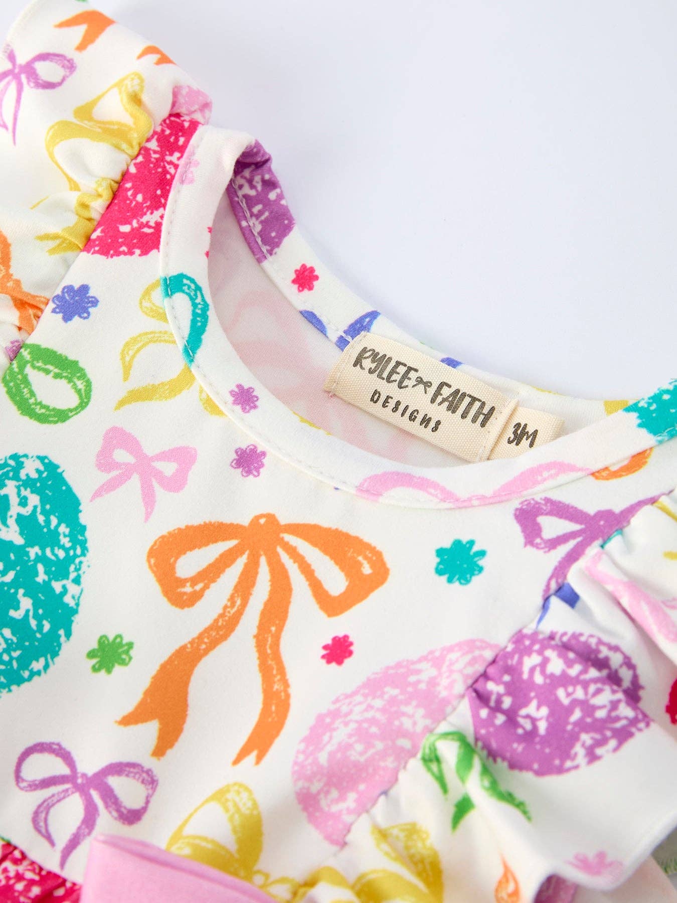 Rylee Faith Designs - Rainbow Easter Egg Print Bow Baby Girls Romper